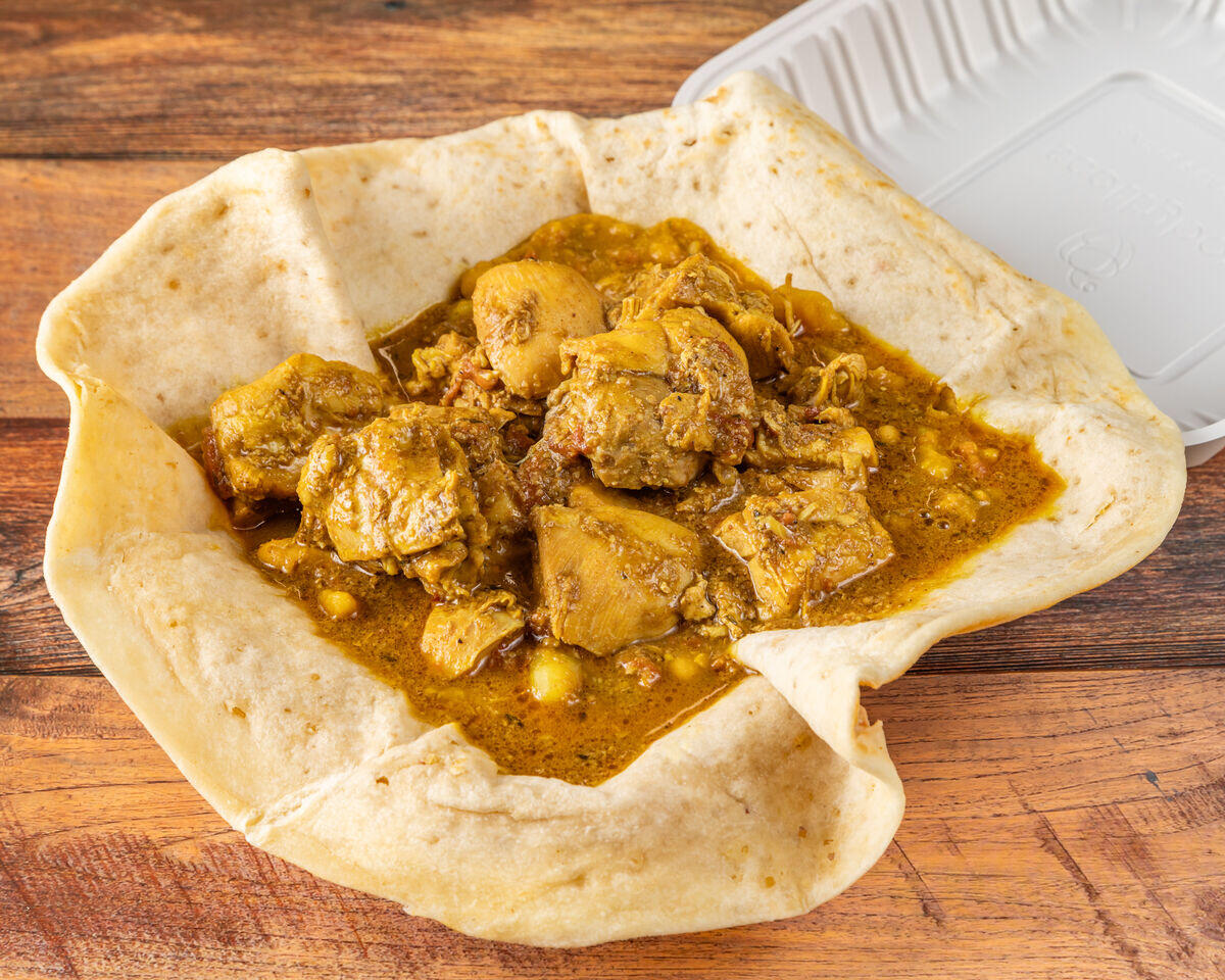 Traditional Guyanese roti with curry, a popular local dish